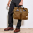 Filson 24-Hour Tin Cloth Briefcase Tan carried in hand 