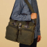Filson-24-Hour-Tin-Cloth-Briefcase-Otter-Green-carrying-on-the-shoulder-close-up
