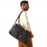 Filson 48-Hour Tin Cloth Duffle Bag Cinder wearing on shoulder