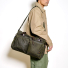 Filson 48-Hour Tin Cloth Duffle Bag Otter Green wearing on shoulder