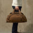 Filson Dryden Duffle Pack Whiskey Wearing in hand