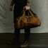Filson Dryden Duffle Pack Whiskey Wearing in hand