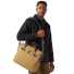 Filson Original Briefcase Tan wearing on shoulder