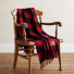 Pendleton Motor Robe with Leather Carrier Rob Roy Red on a chair