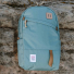 Topo Designs Daypack Classic Mineral Blue on a rock