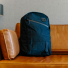 Topo Designs Daypack Tech Navy on a couch