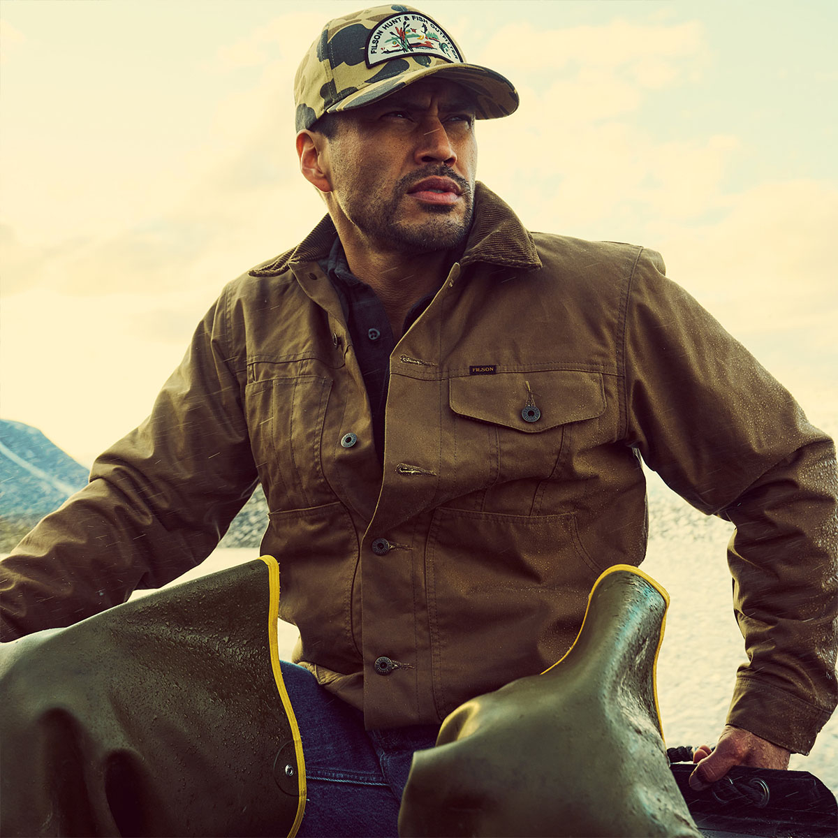 Filson Logger Cap Tan Camo/Hunt Fish, classic Logger Cap features a precurved brim to protect from rain and glare