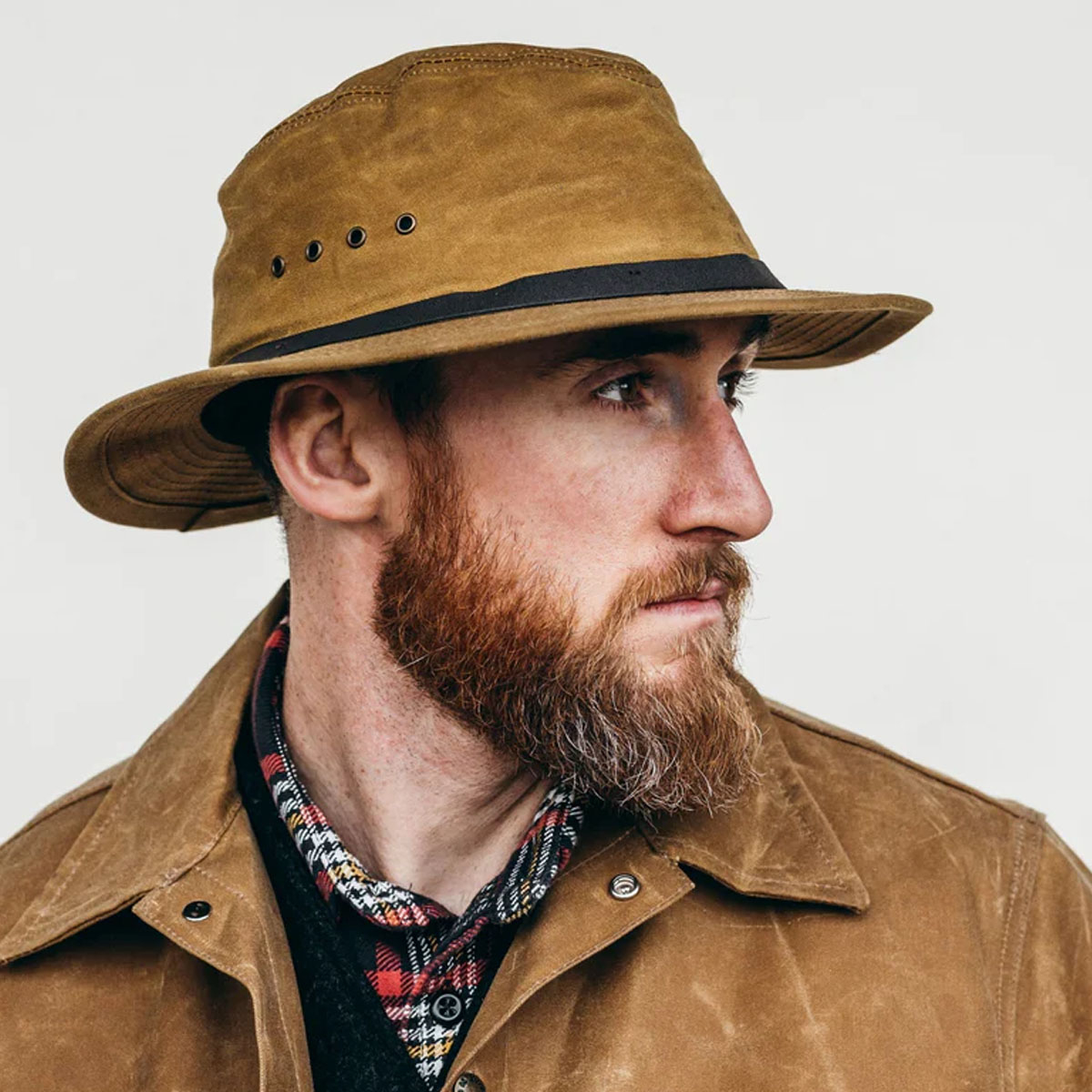Filson Tin Cloth Packer Hat Dark Tan, keeps you protected from the elements Filson Tin Cloth Packer Hat Dark Tan, keeps you protected from the elements