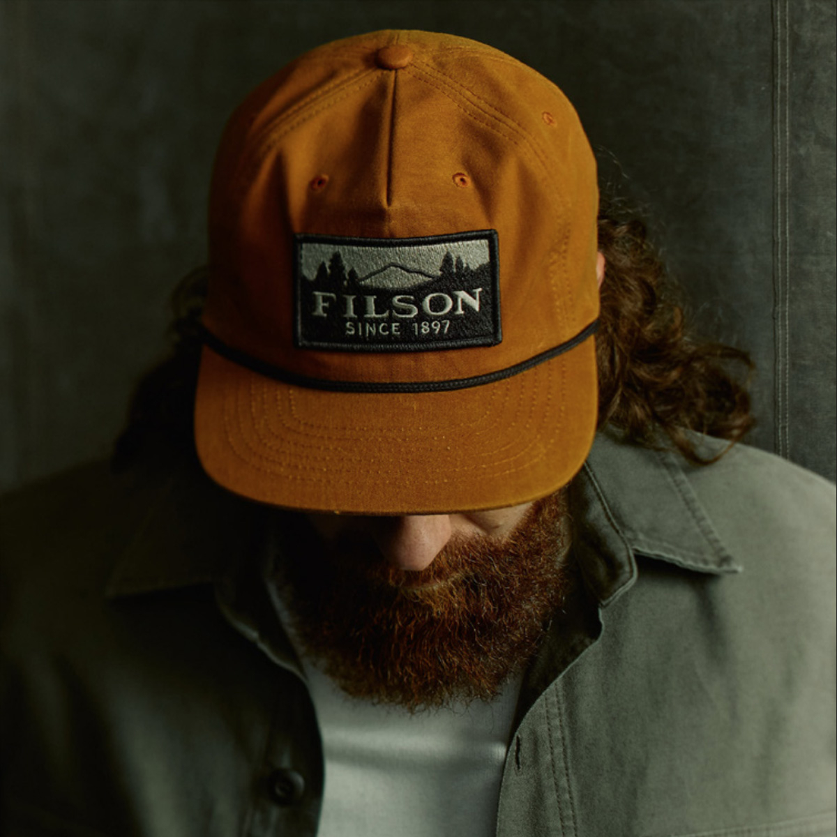 Filson Waxed Trucker Cap Gold Brown/Scenic, classic Trucker Cap features a precurved brim to protect from rain and glare Filson Waxed Trucker Cap Gold Brown/Scenic, classic Trucker Cap features a precurved brim to protect from rain and glare