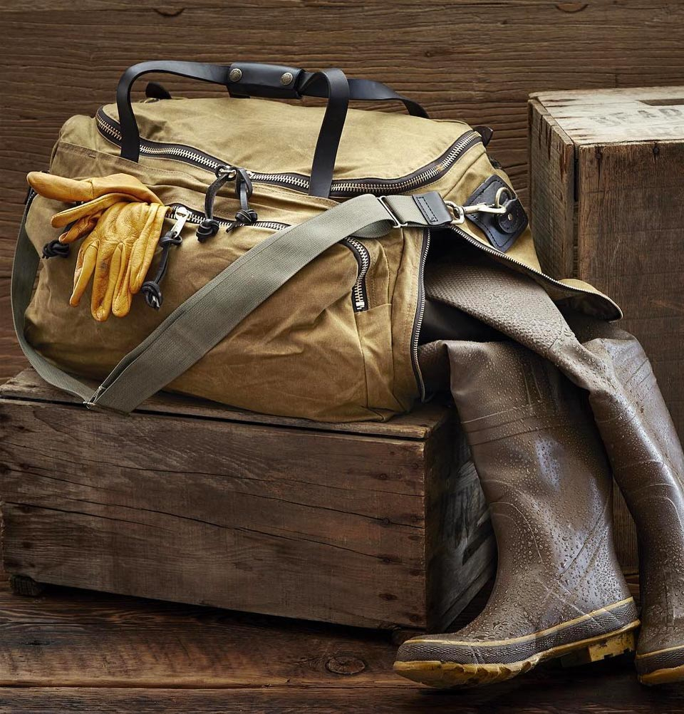 Filson Oil Finish Excursion Bag in the field, a robust bag with special pockets for your muddy gear
