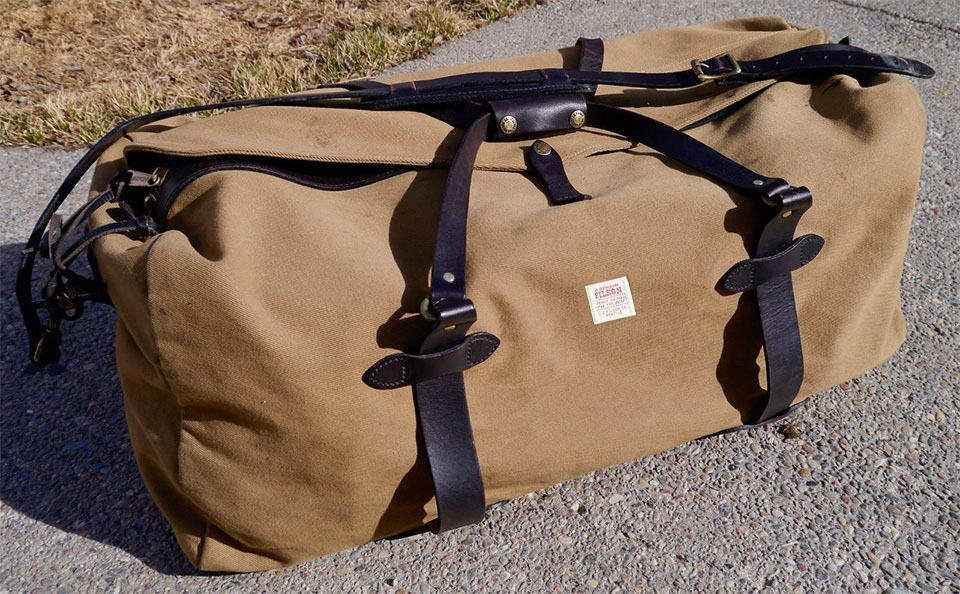 Filson Rugged Twill Duffle Bag Large Tan, water-resistant, spacious duffle develops burnished sheen with use