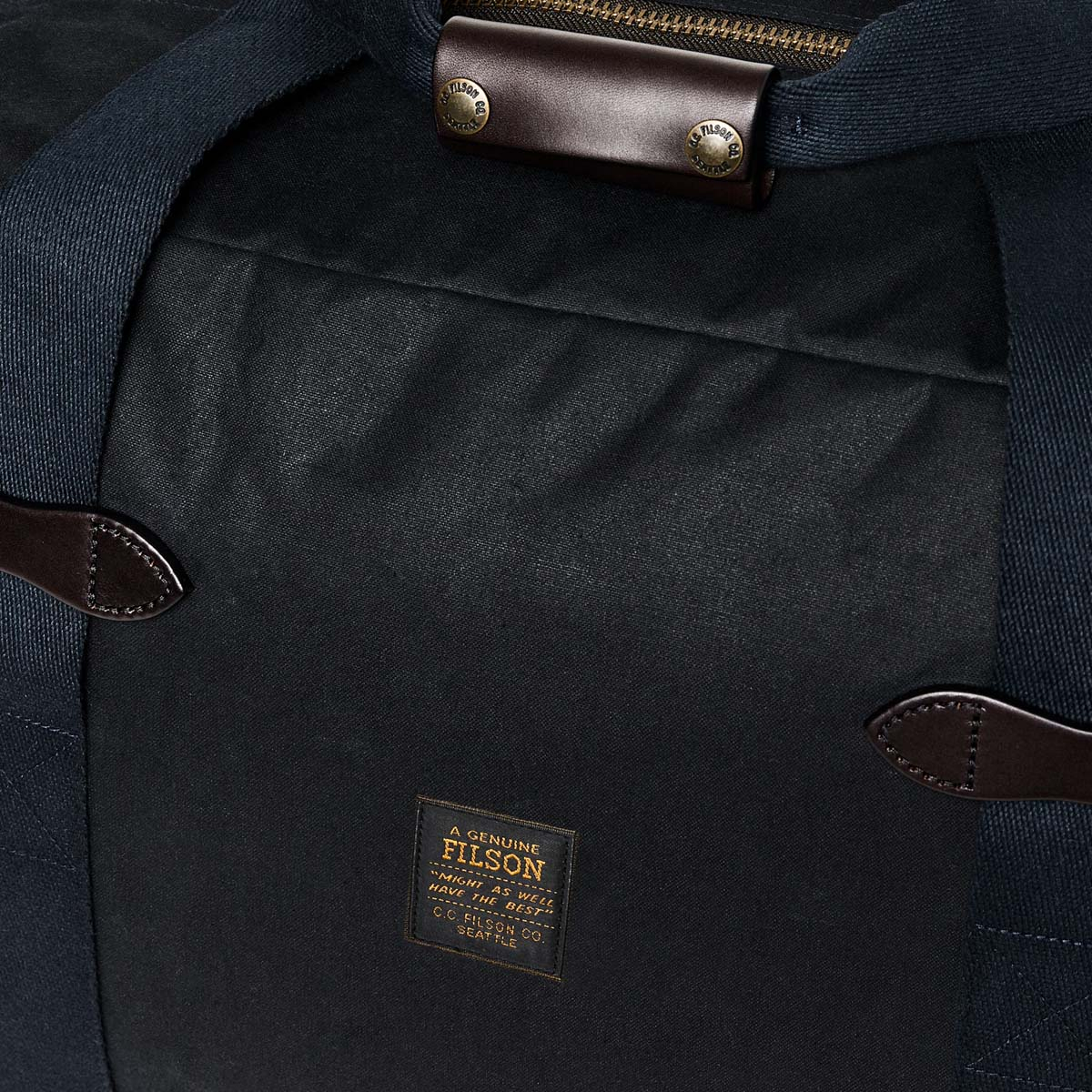 Filson Tin Cloth Small Duffle Bag Navy, a compact waxed-cotton duffle sized for overnight trips