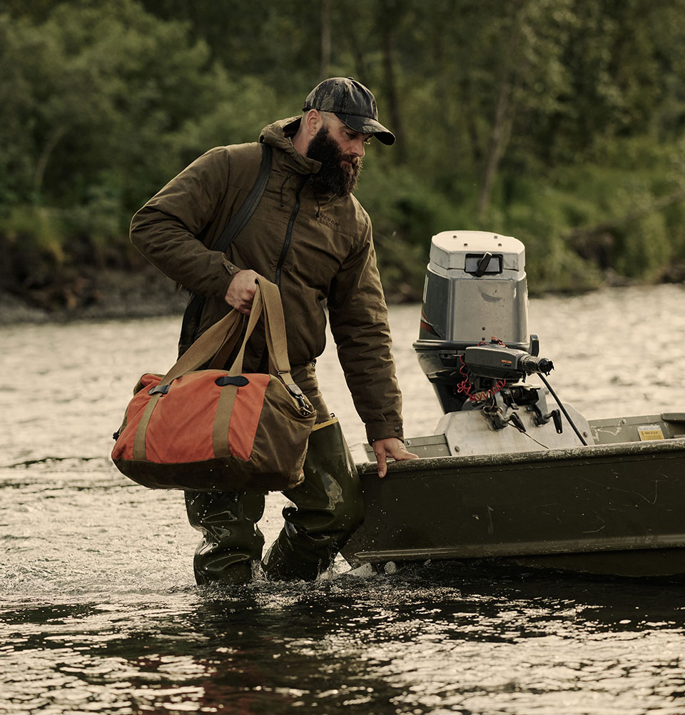 Filson Tin Cloth Small Duffle Bag Dark Tan/Flame, a compact waxed-cotton duffle sized for overnight trips