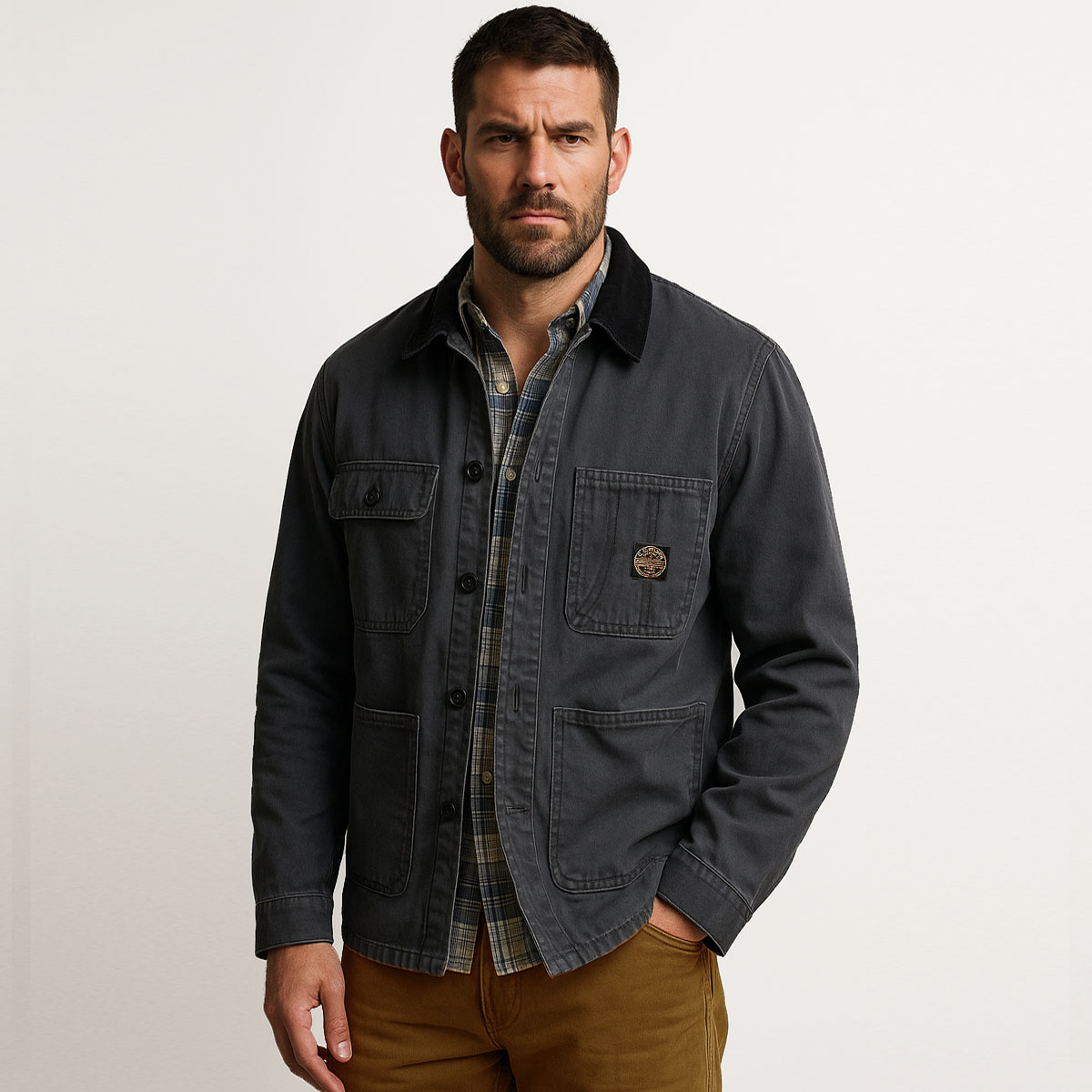 Filson Chore Coat Faded Black, a rugged cotton coat, built to endure and inspired by workwear tradition