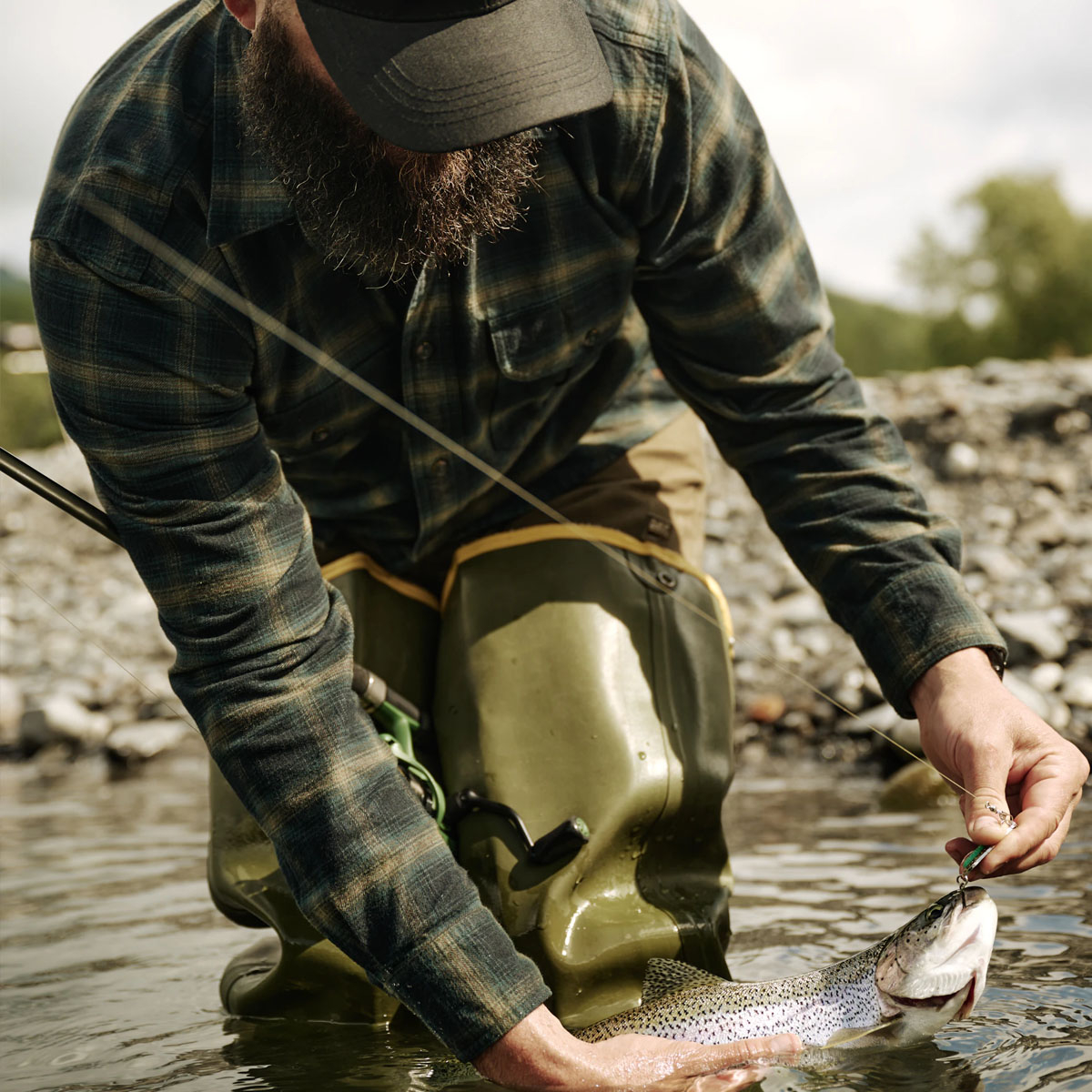 Filson Alaskan Guide Shirt Navy Pine Bronze Plaid, this iconic, breathable flannel shirt has a pleated back for freedom of movement