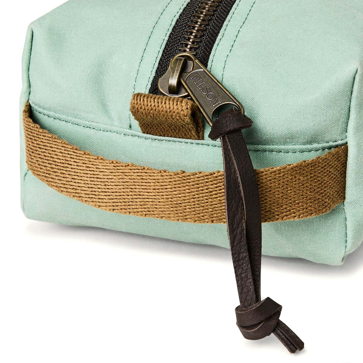 Filson Tin Cloth Travel Kit Granite Green, a compact, light, and tough dopp kit made with heritage materials and modern design