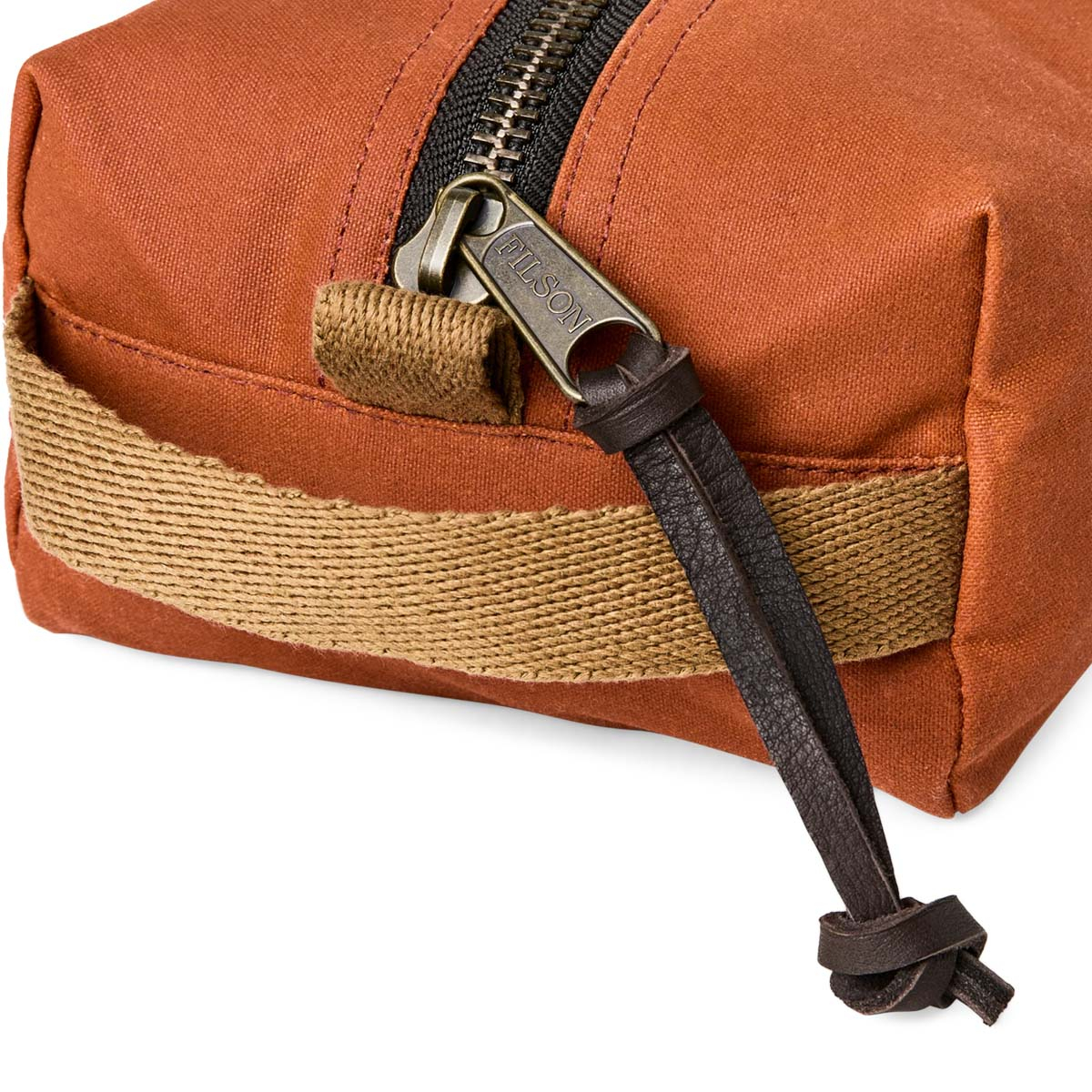 Filson Tin Cloth Travel Kit Rust, a compact, light, and tough dopp kit made with heritage materials and modern design