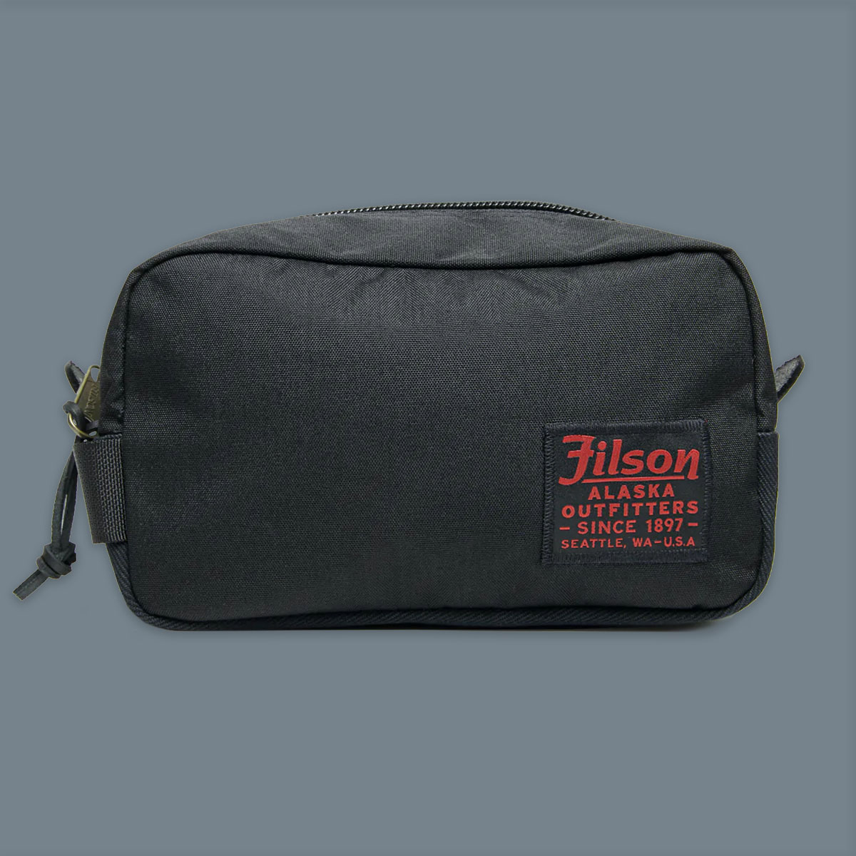 Filson Travel Pack Dark Navy, made of tear-resistant ballistic nylon and reinforced with Filson's famous Rugged Twill
