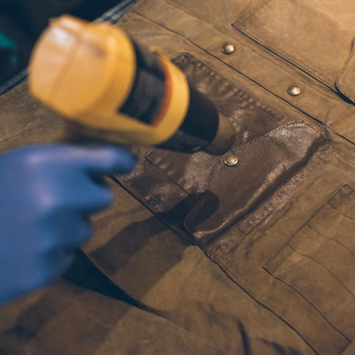 HOW TO REWAX A WAXED CANVAS JACKET, 4. USE A HEAT GUN (OR HAIR DRYER) TO MELT THE WAX INTO THE FABRIC