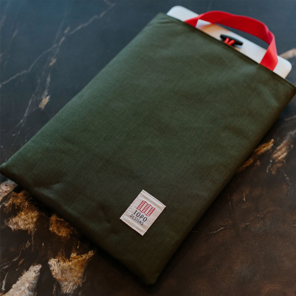 Topo Designs Laptop Sleeve Olive, made with 1000D nylon outer and foam padded body