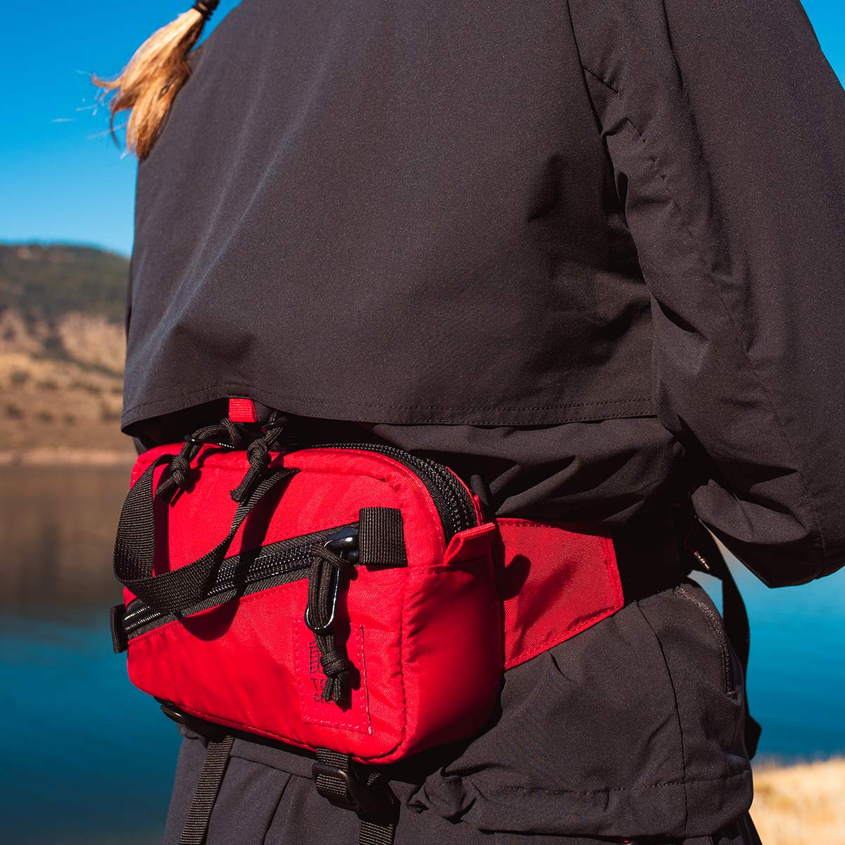 Topo Designs Mini Quick Pack Red, a well-built, secure bag for travel
