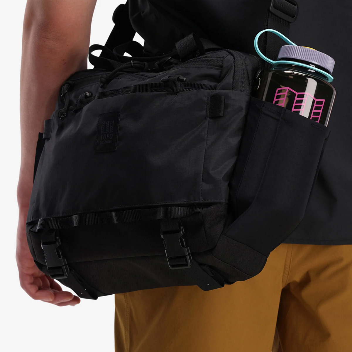 Topo Designs Mountain Cross Bag Black, side pockets fit sized water bottles